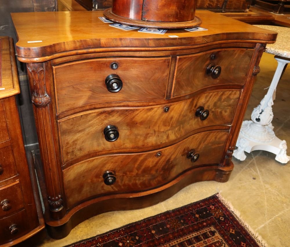 A Victorian mahogany serpentine chest of drawers, W.112cm, D.48cm, H.82cm